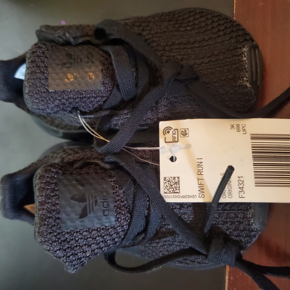 Adidas Black Sneakers with Knit Upper and Sleek Design